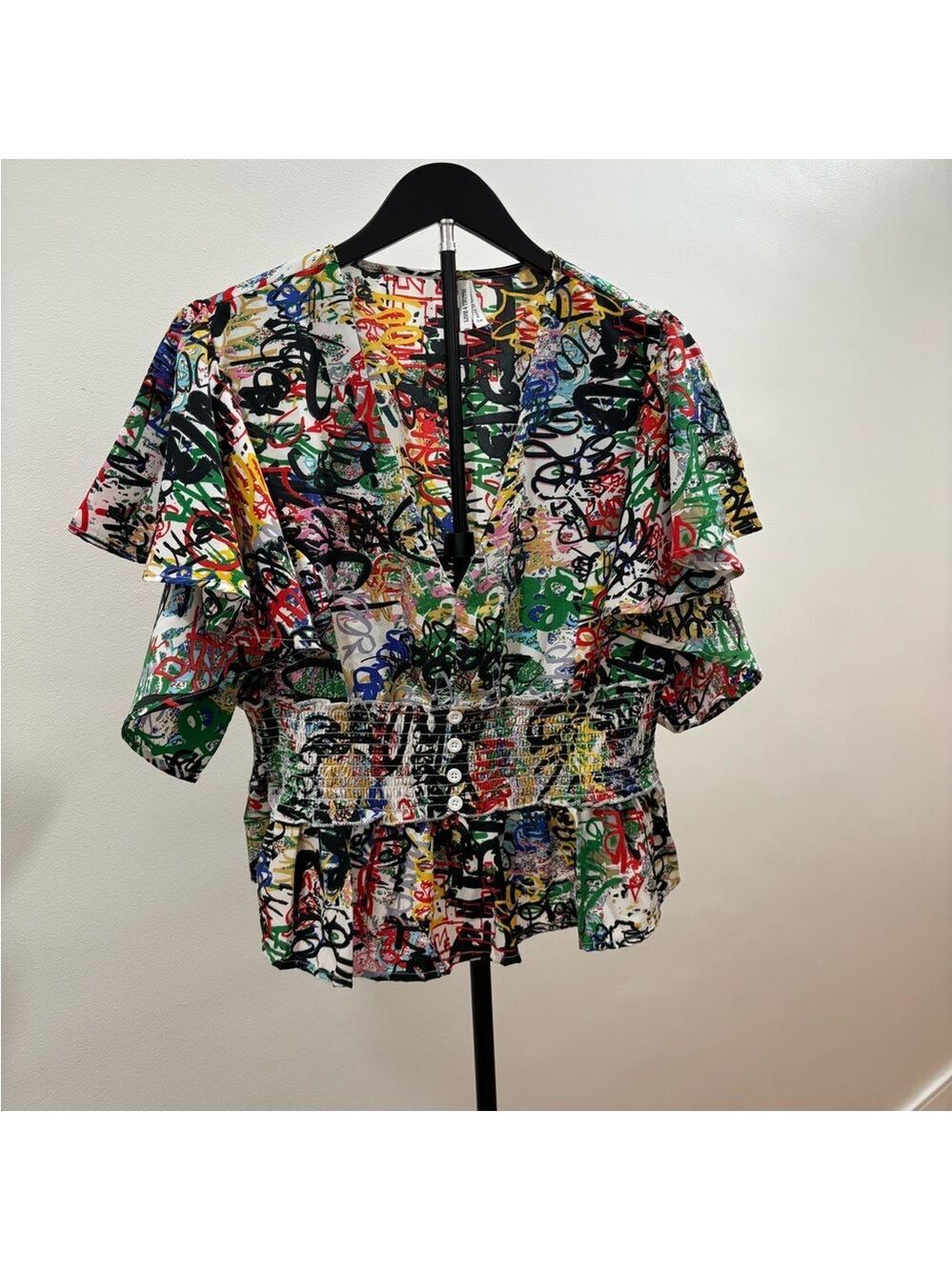 519. Live 4 Truth Multicolor Graffiti-Print V-Neck Blouse W/ Ruffled Sleeves